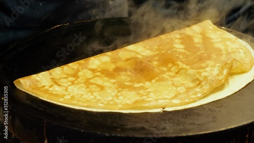 Strasbourg - DEC 26, 2019: Preparation of delicious crepes at the Christmas market in Strasbourg