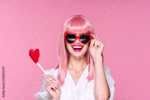 portrait of young woman with lollipop