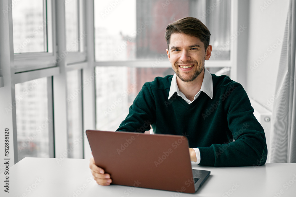 businessman working on his laptop in office businessman working on his laptop in office