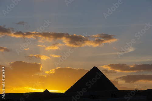 The Sun is going down behind the Pyramid of Menkaure