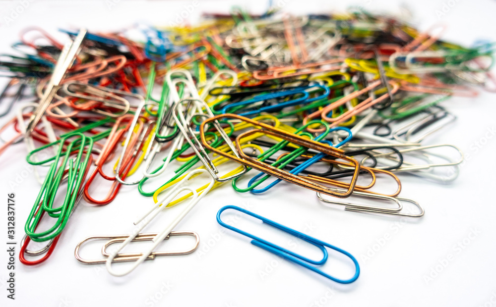 A pile of paper clips against a white background. A pile of paper clips against a white background.