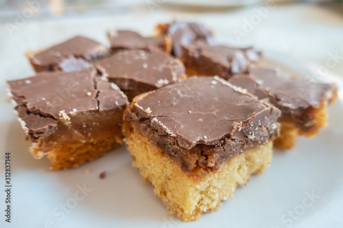 Slices of chocolate covered caramel shortbread