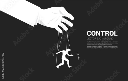 Puppet Master controlling Silhouette of businessman. Concept of manipulation and micromanagement
