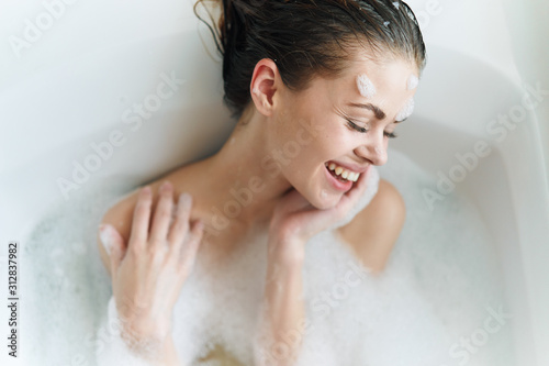 woman in bath with foam