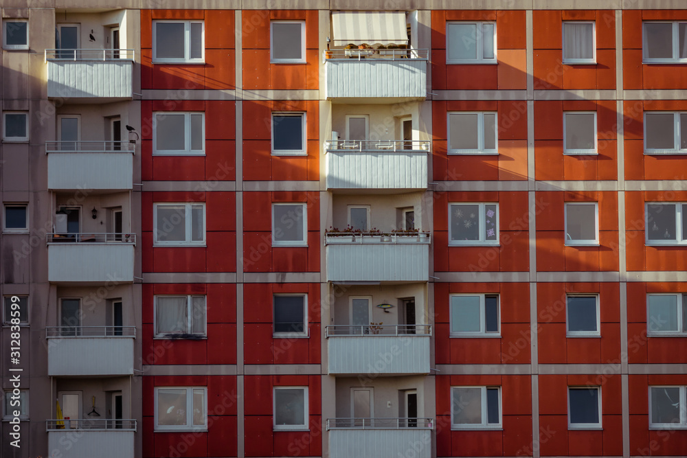 Front view of big building with appartements and shadows