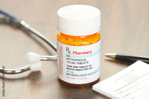 Generic Metroprolol Prescription on physician's desk with stethoscope and prescription pad photo