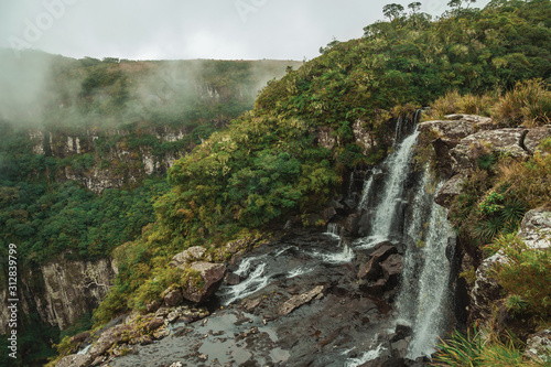 Black Tiger Waterfall on cliff with mist