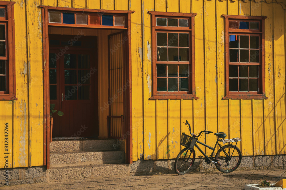 Old house and bike in a street of Cambara do Sul Old house and bike in a street of Cambara do Sul
