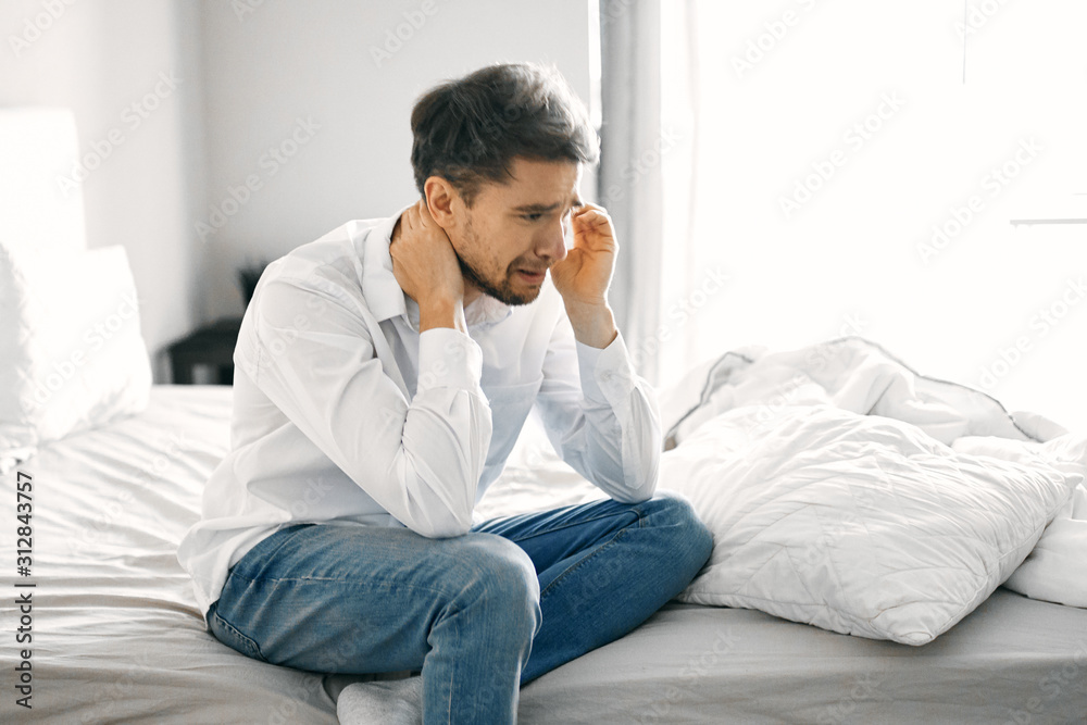 young man sitting on sofa at home young man sitting on sofa at home