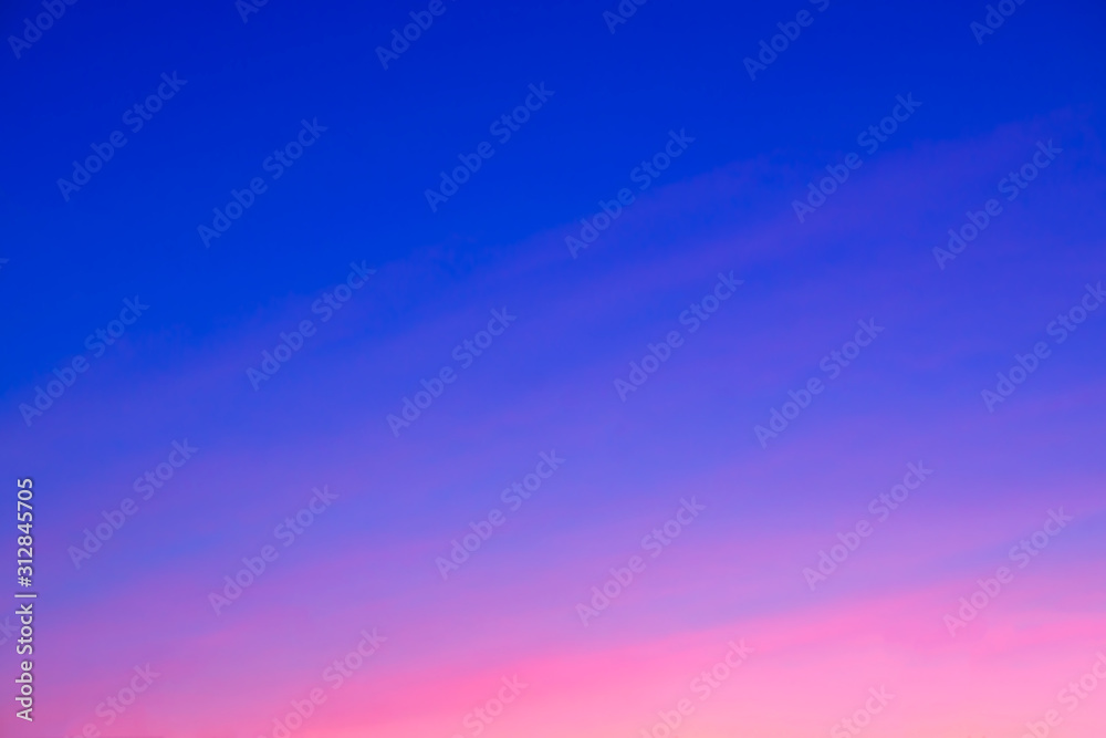 Obraz premium Beautiful pink sunset. For the background. Blue sky