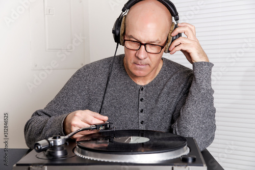 man  listens to records photo