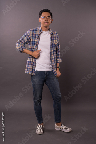 Portraiture of Asian boy with casual out fit.Studio shot.