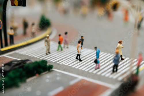 Fototapeta Naklejka Na Ścianę i Meble -  Small people or small people walk on many streets.