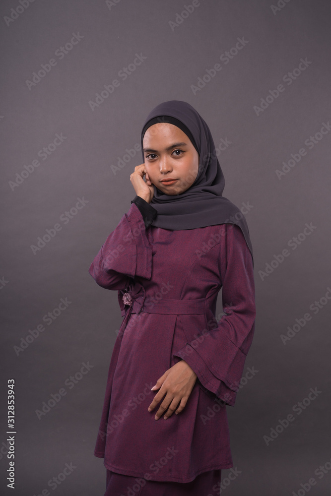 Portraiture of Muslim Girl wearing hijab.Studio Shot. Portraiture of Muslim Girl wearing hijab.Studio Shot.