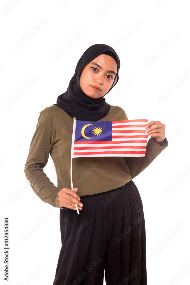 Happy young Malaysian girl holding Malaysia Flag isolated over white background.Independence Day concept.