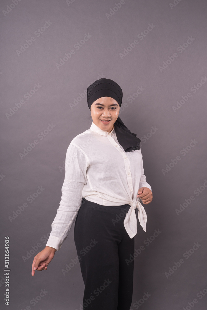 Portraiture of young asian girl wearing turban.Studio shot. Portraiture of young asian girl wearing turban.Studio shot.