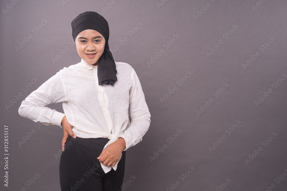 Portraiture of young asian girl wearing turban.Studio shot.