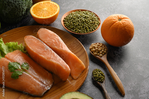 salmon pieces on a wooden plate. selective focus.