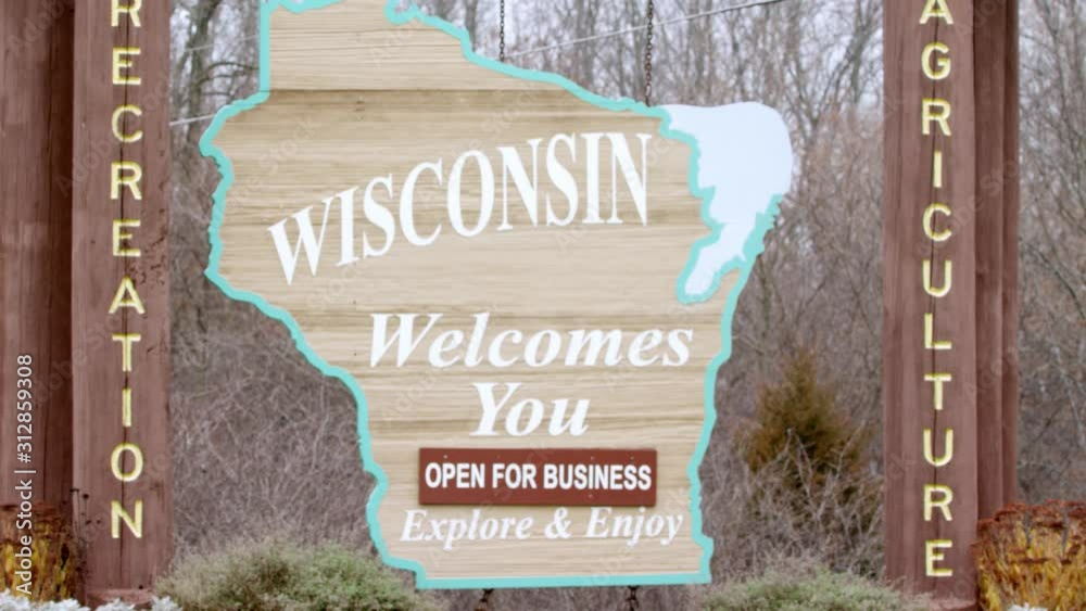 Welcome to Wisconsin Signage shot in close up form, panning right to left at intro to establish.