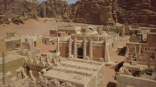 Aerial Footage of Fast Flight into Center Abandoned Fortress in Wadi Rum Desert photo