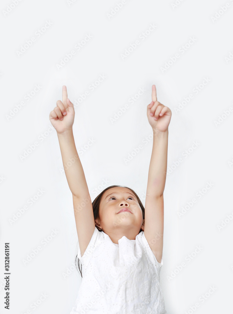 Portrait of Asian little child girl pointing two forefinger up and looking above isolated over white background. Portrait of Asian little child girl pointing two forefinger up and looking above isolated over white background.