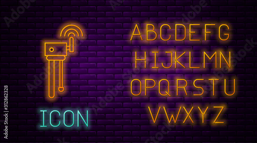 Glowing neon line Router and wi-fi signal symbol icon isolated on brick wall background. Wireless ethernet modem router. Computer technology internet. Neon light alphabet. Vector Illustration