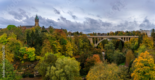 The Adolphe Bridge and BCEE or Luxemburgish Spuerkeess Clock Tower in the UNESCO World Heritage Site of Luxembourg photo