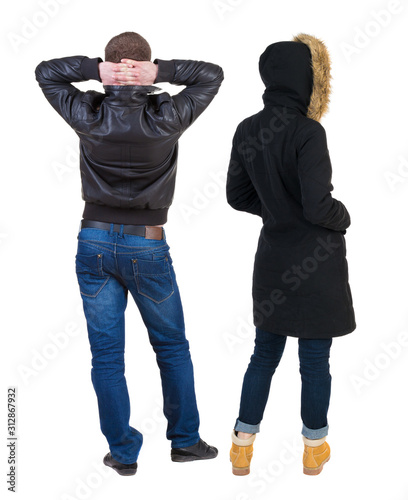 Back view of couple in winter jacket.
