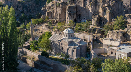 View of St. Gregory's Church (Buyuk Kilise Camii Mosque) in Monastery Valley Or Manastir Vadisi, Guzelyurt, Aksaray Province, Cappadocia, Turkey photo