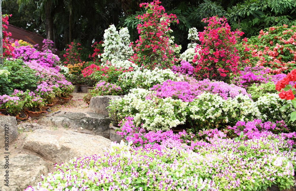 Landscaped flower garden with lots of colorful blooms 