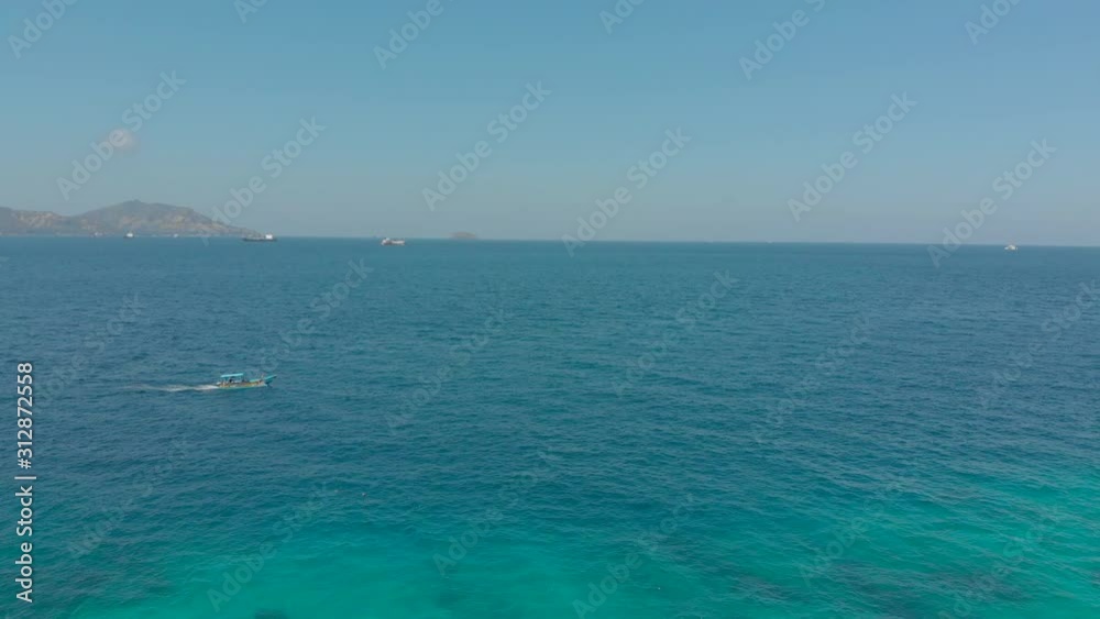 Aerial shot of traditional Balinese boats in an open sea. Travel to Indonesia concept Aerial shot of traditional Balinese boats in an open sea. Travel to Indonesia concept