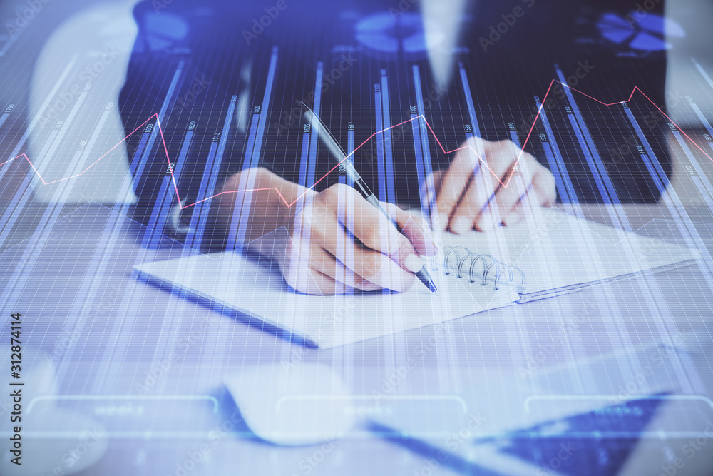 Forex graph on hand taking notes background. Concept of research. Multi exposure Forex graph on hand taking notes background. Concept of research. Multi exposure