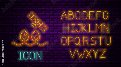 Glowing neon line Smart farm with drone control and tree icon isolated on brick wall background. Innovation technology for agricultural company. Neon light alphabet. Vector Illustration