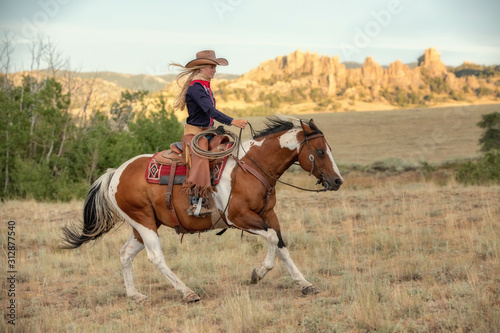 Cowgirl on Paint Horse