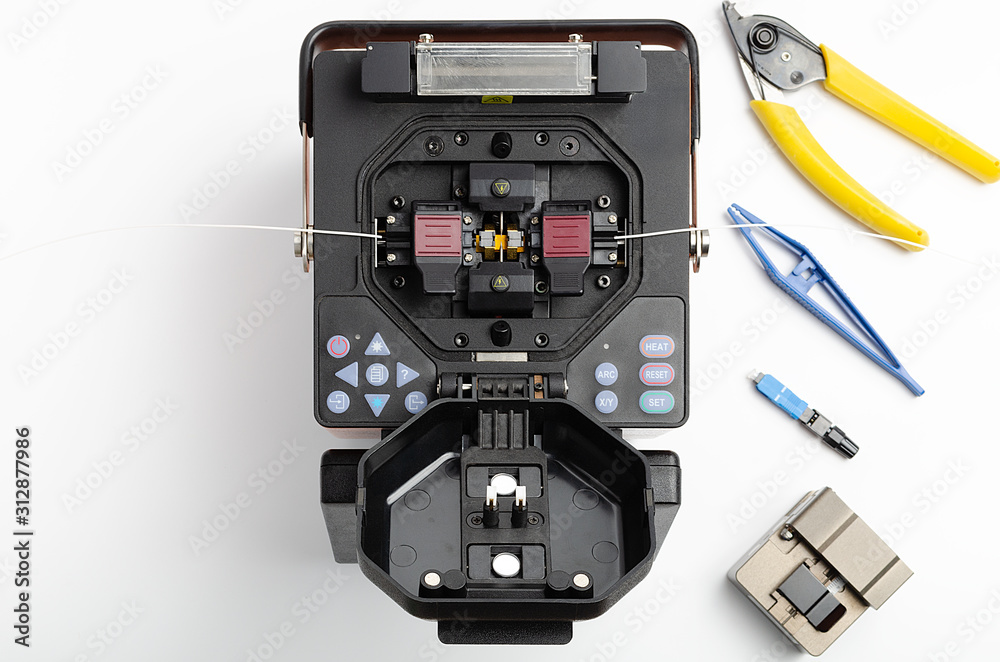 Welding machine and tool kit for stripping and welding of optical fiber Welding machine and tool kit for stripping and welding of optical fiber