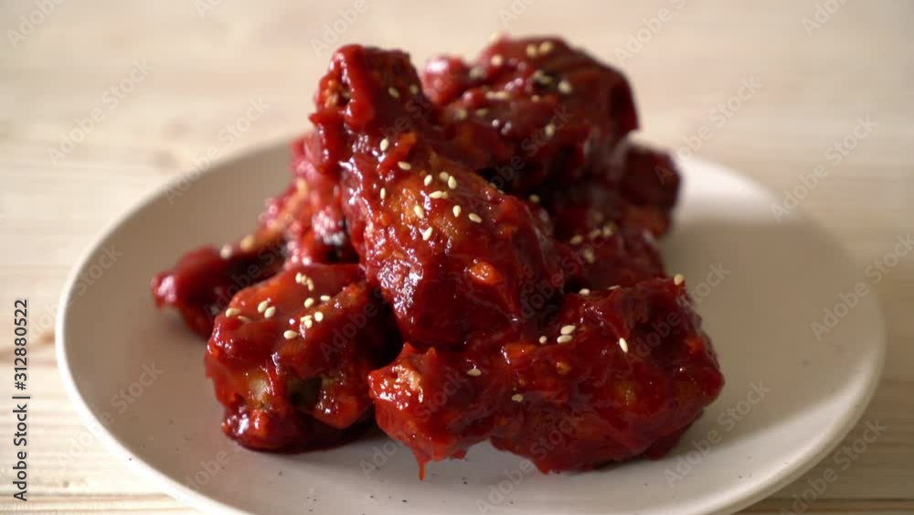 fried chicken with spicy sauce in Korean style fried chicken with spicy sauce in Korean style