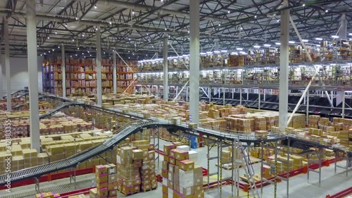 Huge automated warehouse with moving boxes on a conveyor belt