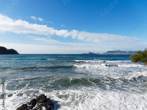 View on Mediterranean sea, shores, calanques and waterfront landscape of La Ciotat, eagle's beak, calanque du Mugel from Sandy beach at Les Lecques in Saint-Cyr-sur-Mer in French Riviera photo