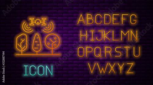 Glowing neon line Smart farm with drone control and tree icon isolated on brick wall background. Innovation technology for agricultural company. Neon light alphabet. Vector Illustration