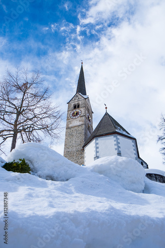 swiss romanic church in snow