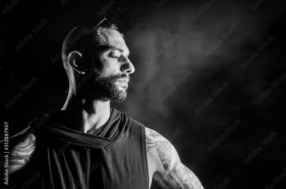 Fototapeta premium B/W male portrait at dark background