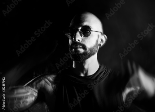 B/W male portrait at dark background