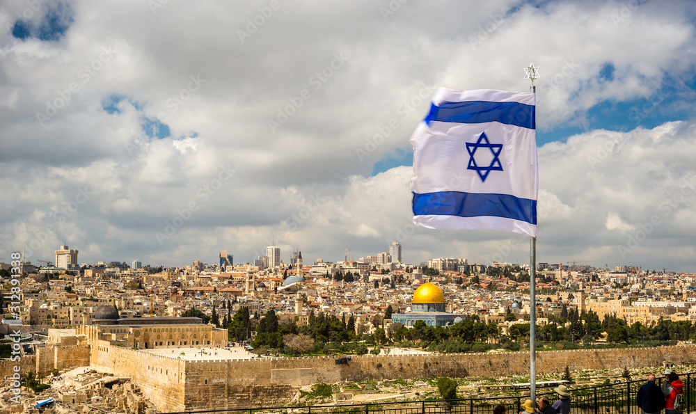 Fototapeta premium Israeli flag flying over Jerusalem