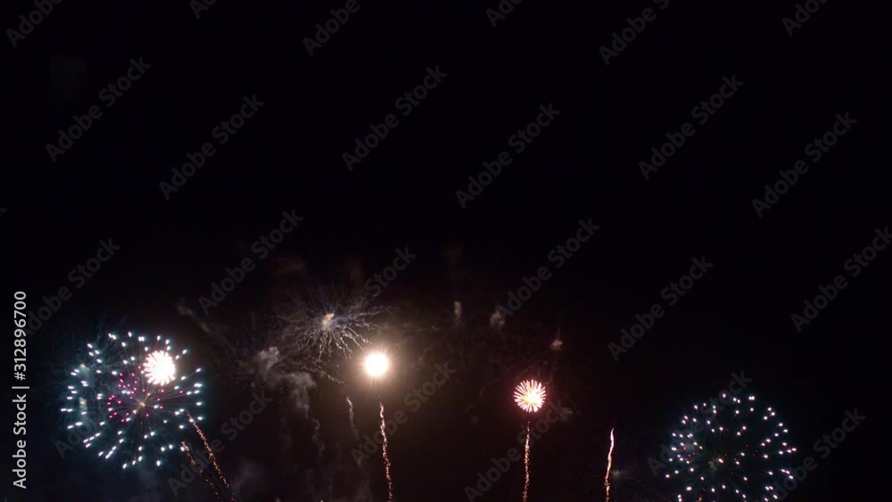 Beautiful abstract colourful Fireworks explode display on sky at night a symbol of celebration in New years anniversary for background
