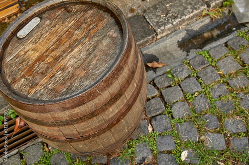 old wine barrel on the paving stones