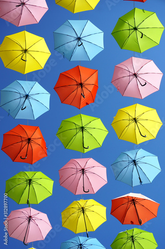 multicolored umbrellas in blue sky