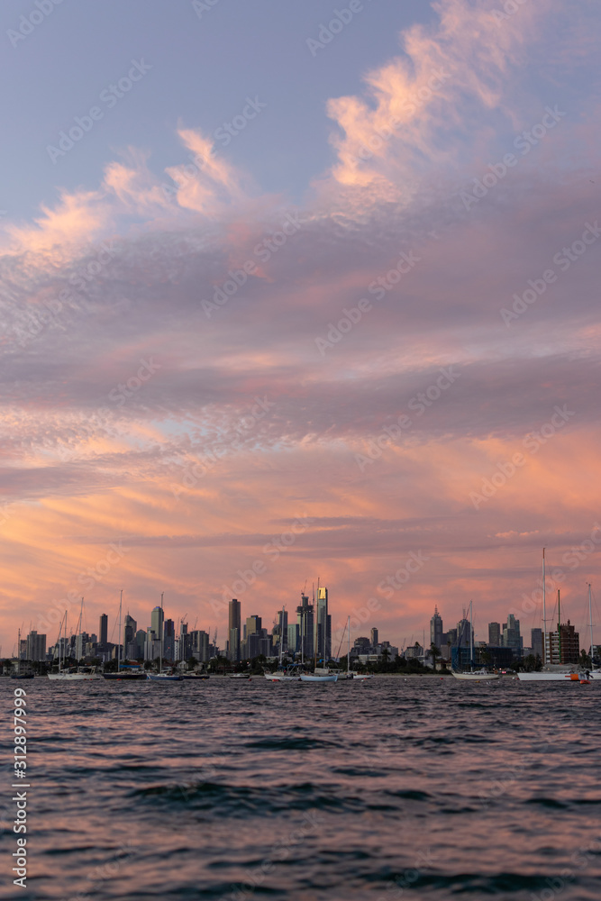 Water views of Melbourne skyline at sunset from St Kilda Pier