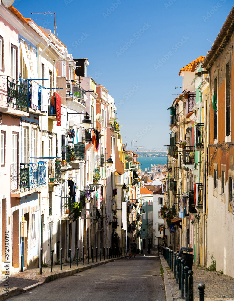 Portugal, Lisbon in summer, local color of narrow old street in Lisbon, street facing to the river Tagus Lisbon