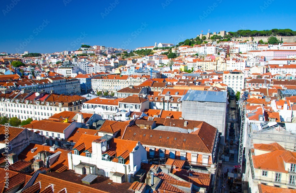 Portugal, panoramic view of old town  Lisbon in summer, touristic centre of Lisbon, St. George's medieval Castle in Lisbon, forest on the highest hill in Lisbon, Lisbon red tile roofs Panoramic view