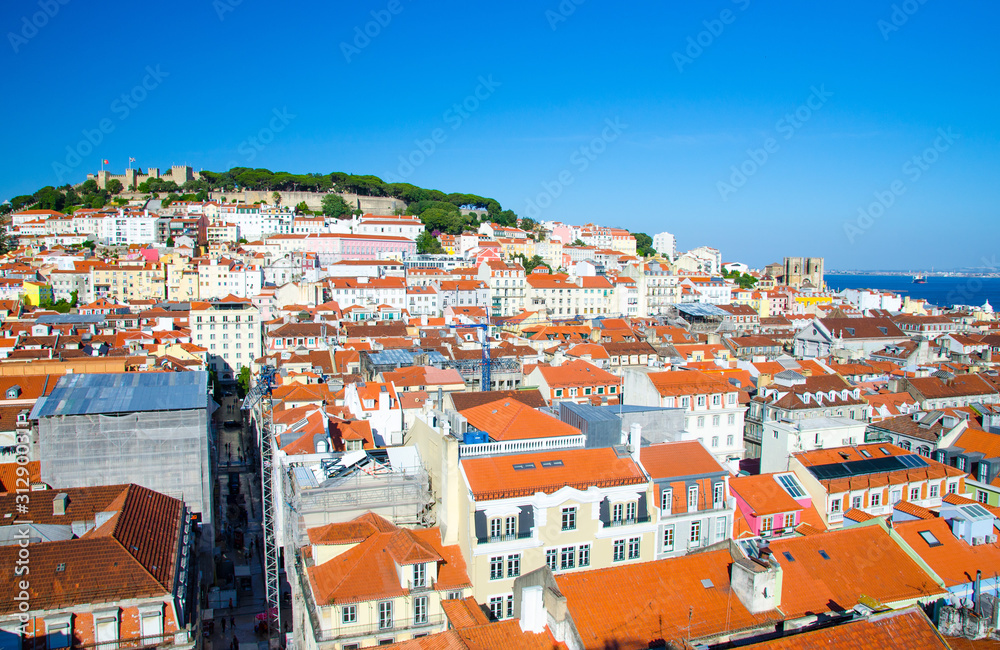 Portugal, panoramic view of old town  Lisbon in summer, touristic centre of Lisbon, St. George's medieval Castle in Lisbon, forest on the highest hill in Lisbon, Lisbon red tile roofs Panoramic view
